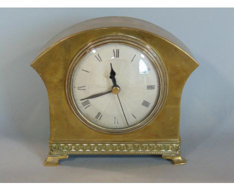 Stylish French brass mantle clock, with textured silvered dial, Roman numerals, the case with Greek key foot rim, upon four c