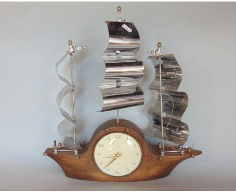 Novelty Smiths mantle clock in the form of a three mast ship with three shaped chrome sails, the convex dial with Arabic nume