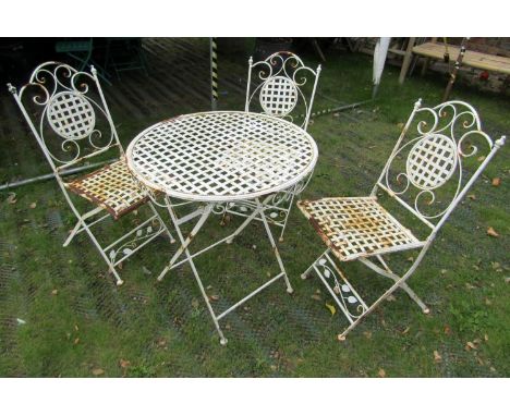 A weathered contemporary light steel four piece garden terrace set comprising circular top table and three matching chairs wi