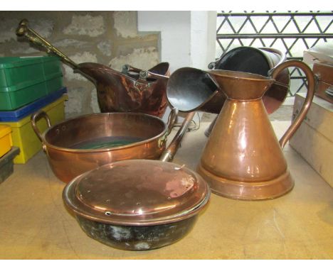 A 19th century copper helmet shaped coal scuttle, one other, a circular copper two handled pan, 19th century copper bed warmi