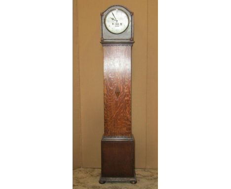 An early 20th century oak Grandmother clock, with circular dial and applied mouldings 