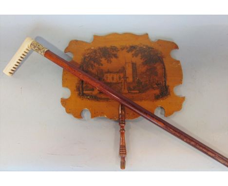 A Mauchline ware hand fan, the front decorated with a chapel scene with a carriage with a further boy climbing in a tree vers