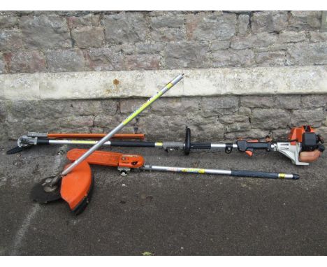 A Stihl KM85R petrol engine/combi garden tool with hedge trimmer attachment, circular blade and pruning saw 