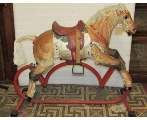 A vintage Triang child's light steel/tin rocking horse with tubular stand (AF) 