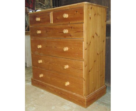 A Victorian style stripped pine bedroom chest of two short over four long graduated drawers and moulded plinth, 108 cm wide x