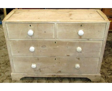 A Victorian stripped pine chest of two short over two long graduated drawers on short bracket supports (AF), 105 cm wide x 74