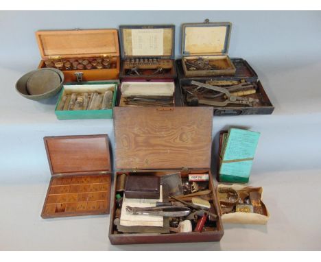 A box of interesting items to include watchmakers tools in various wooden boxes, other tools, collection of watch keys etc (a