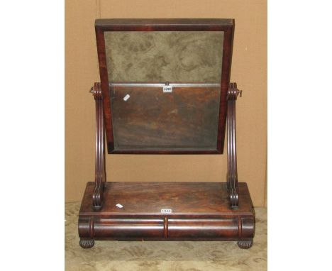 A late regency/William IV mahogany toilet mirror, with rectangular plate, scrolled supports and platform base, fitted with tw