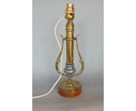 A weighted brass stick lamp, on a swivel platform, 32cm high 