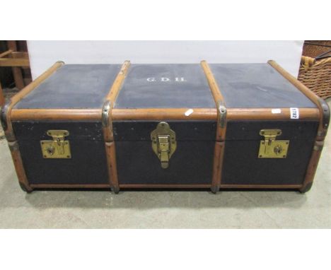 A vintage blue fibre and timber lathe bound cabin trunk together with a green painted steel ex military trunk with drop handl