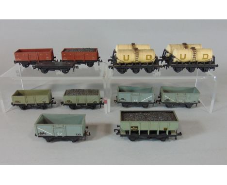 12 Hornby Dublo wagons including a grey hopper coal wagon marked21T. 6 open wagons, a coal wagon marked 13T and 4 United Dair