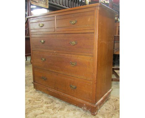 An Edwardian walnut bedroom chest of two short over three long graduated drawers with incised line detail, 106cm wide x 107cm