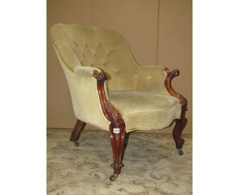 A Victorian spoon and button back drawing room chair, with partial rosewood show wood frame, scrolled arms, acanthus detail a