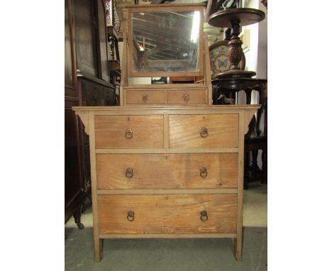 An arts and crafts ash dressing chest of two long and two short drawers, beneath two trinket drawers and swing mirror, 91cm w