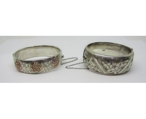 Silver hinged bangle with gold Tudor rose decoration and engraved foliate detail, maker 'L &amp; Co' and a further example wi