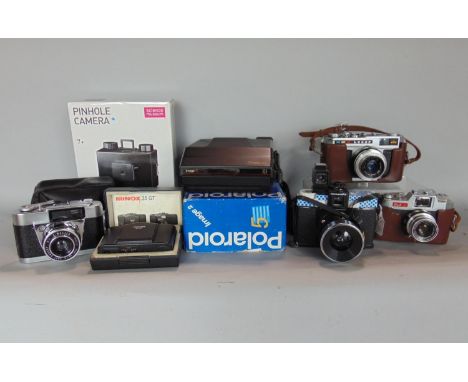 Box of seven cameras to include Minox and three other 35mm cameras and others 