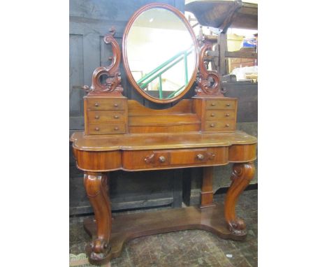 A Victorian mahogany dressing table with matching marble top wash stand, the dressing table supporting an oval mirror plate w