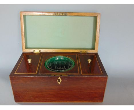 19th century, probably plum pudding mahogany and boxwood inlaid tea caddy, the hinged lid enclosing a fitted interior with tw