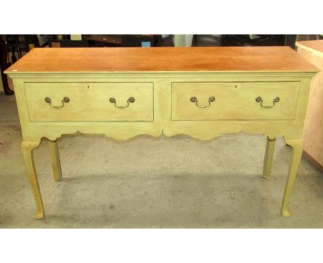 A Georgian style oak dresser fitted with two frieze drawers over a shaped apron, supports and pad feet (later light green pai
