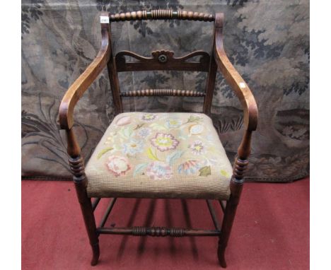 A regency beechwood Countrymade elbow chair with pierced splat, further bobbin rails and hand worked tapestry seat 