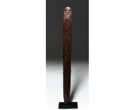 Pre-Columbian, Peru, Chimu, ca. 1000 to 1200 CE. An elegant loom stick carved from a hard wood, adorned with a human visage w