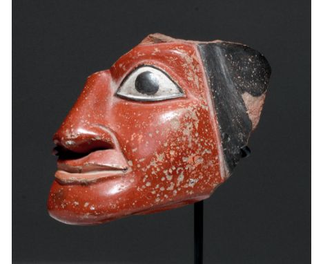 Pre-Columbian, Southern Peru, Nazca, ca. 200 to 400 CE. A large, expressive section of a fine terracotta portrait vessel feat