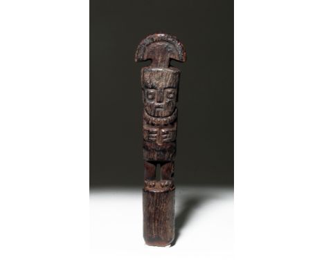 Pre-Columbian, Central Coast Peru, Huari/Wari, ca. 700 to 1000 CE. A finely carved wooden implement carved with a standing de