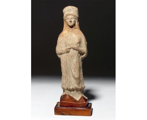 Greece, South Italic colonies, ca. 4th century BCE. An elegant ceramic figure depicting Demeter, the Greek goddess of the har