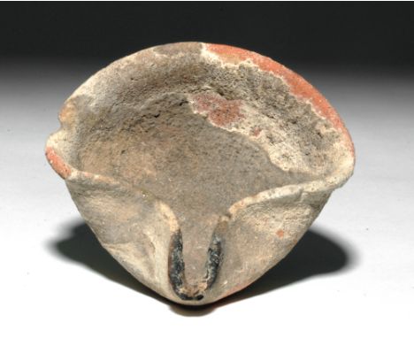 Ancient Near East, Holy Land, Iron Age, ca 1400 BCE. A wonderful Holy Land clay oil lamp of a simple design with a pinched ri