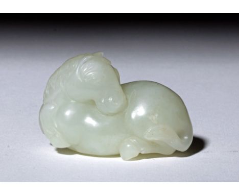 Far East, China, ca. early 19th century CE. A beautiful Chinese carved white jade recumbent horse with head thrown back, love