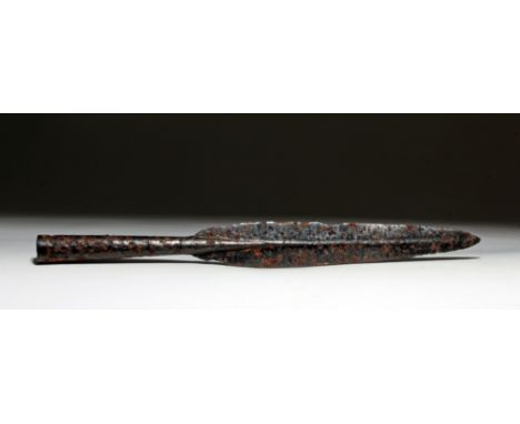 Europe, ca. 800 to 500 BCE. This is a hammered iron spear head with a tapered, leaf-shaped design, a slight ridge, and a slen