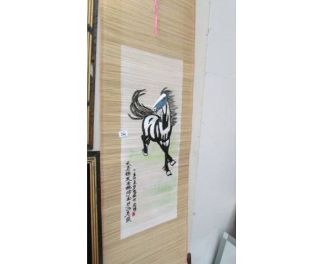 A Chinese scroll depicting a horse.
