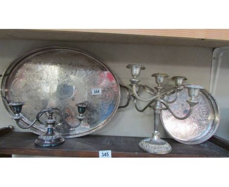 Two silver plate trays and two silver plate candelabra. COLLECT ONLY.