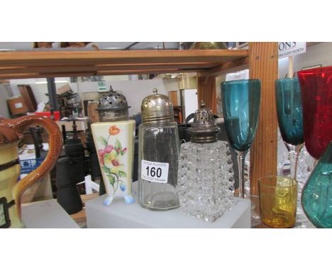 Two glass and a ceramic sugar sifter.