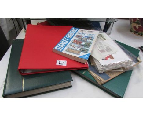 A quantity of stamp albums and first day covers.