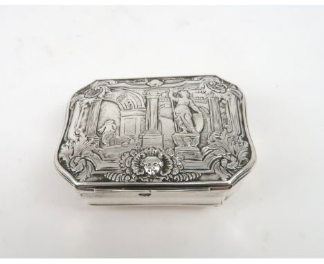 A GEORGE II SILVER SNUFF BOX of cartouche form, the hinged lid chased with a classical scene of a statue in an architectural 