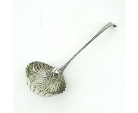 A GEORGE III SILVER SOUP LADLE in a beaded Old English pattern, with a circular shell bowl, with monogrammed terminal, London