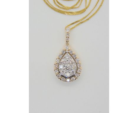 A DIAMOND SET PENDANT AND CHAIN from the Jewellery Channel Iliana collection, the 14k gold pear shaped pendant is set with es