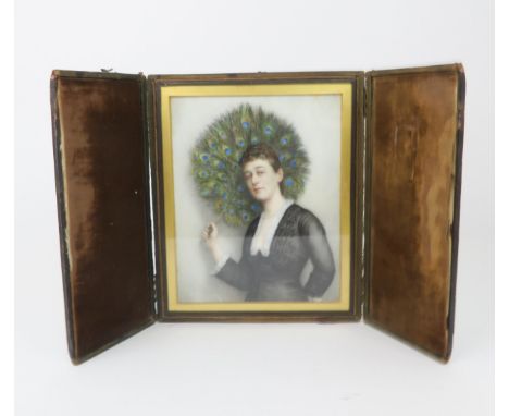 A 19TH CENTURY PORTRAIT MINIATURE OF A LADY modelled standing and holding a peacock feather fan, painted on a white glass pan