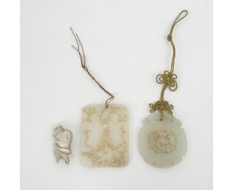 A CHINESE JADE PENDANT  Carved with a central foliate medallion 5.5 x 4.6cm, a rectangular pendant carved with two figures, 6