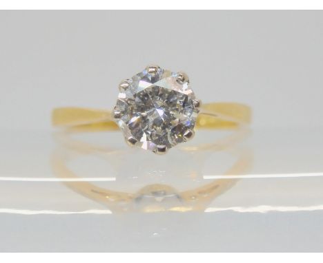 A SOLITAIRE DIAMOND RING the 18ct yellow and white gold classic crown mount is set with an estimated approx 0.98cts brilliant