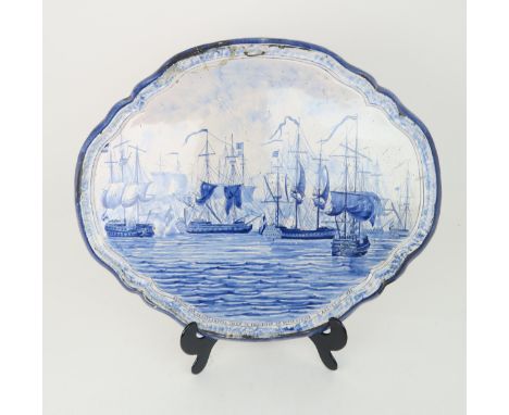 A LARGE 19TH CENTURY COMMEMORATIVE DUTCH DELFT BLUE AND WHITE SHAPED OVAL PLAQUE  by Makkum, painted with battle ships, comme