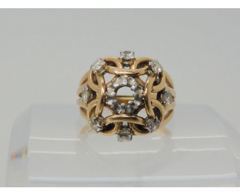 A HANDMADE KNOT PATTERN RING made in rose coloured metal, set with estimated approx 0.60cts of brilliant cut diamonds, (the c