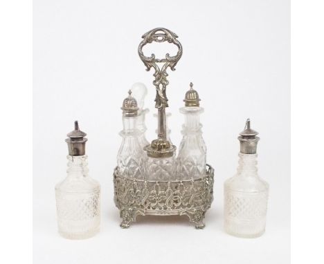 A MATCHED VICTORIAN SILVER CRUET STAND of oval form, the body of scrolling foliate openwork, on four bracket feet, with a scr