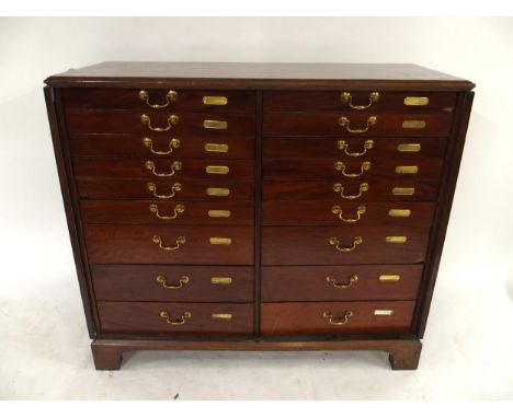 A VICTORIAN MAHOGANY SPECIMEN CABINET with a pair of panel cabinet doors concealing twenty graduating drawer on bracket feet,