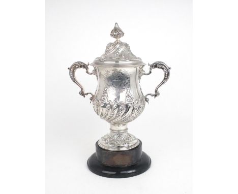 A GEORGE III SILVER TWIN HANDLED CUP AND COVER the baluster form body embossed with spiral fluting decoration, engraved with 