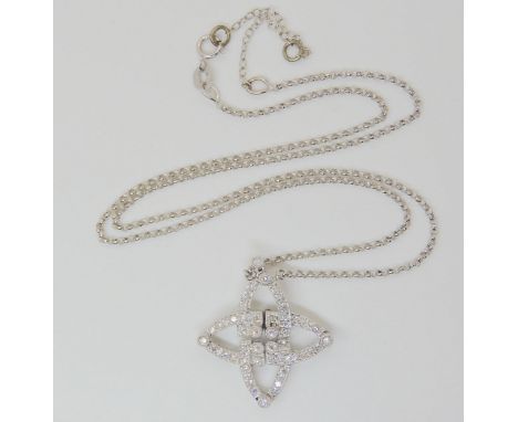 AN UNUSUAL MAGNETIC DIAMOND NECKLACE the 18k white gold necklace can be worn in two ways as a star shaped pendant or as a sca