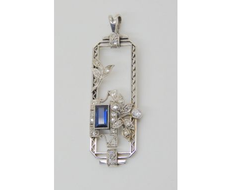 AN ART DECO DIAMOND & SAPPHIRE PENDANT set throughout in 18ct white gold and platinum with floral detailed mount, set with a 