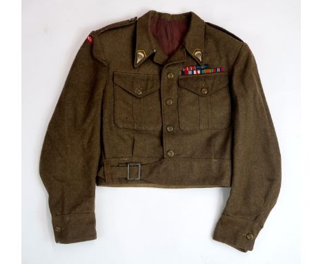 A SCARCE WW2 POLISH PARATROOPER'S KHAKI SERGE BATTLEDRESS TUNIC  With epaulette rank insignia for Kapral (Corporal) and embro