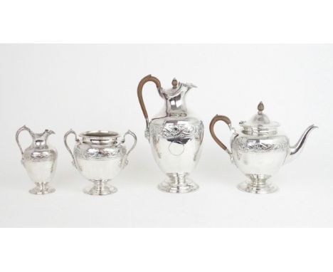 A VICTORIAN&nbsp; SCOTTISH SILVER FOUR PIECE TEA SERVICE of swollen baluster form, the bodies with a band of embossed celtic 